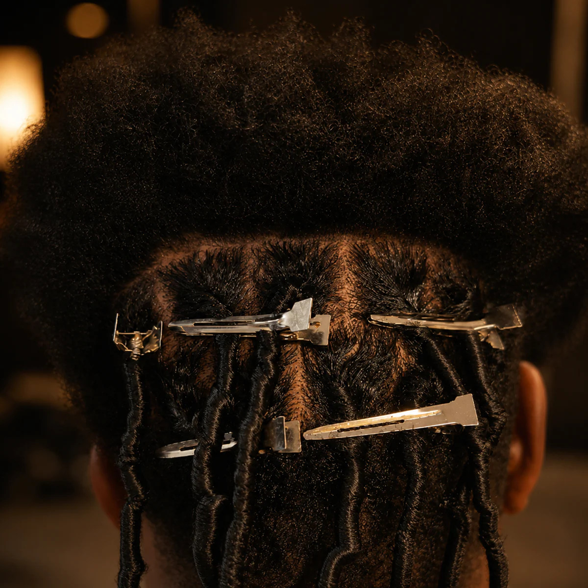 New loc foundation in progress with the remaining natural hair sectioned above